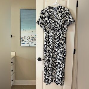 NWT Old Navy dress. Blue and white floral print with cut out sides. Never worn.